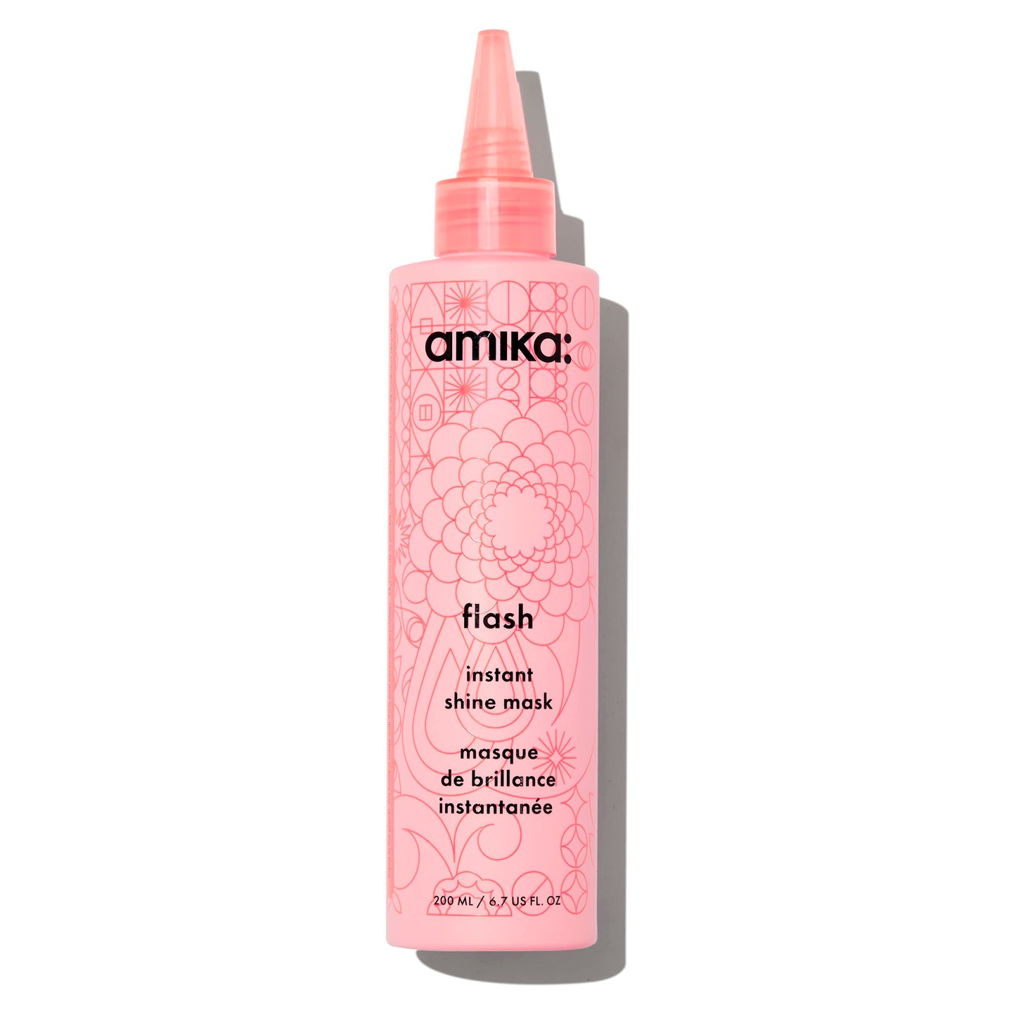 Pink bottle of amika flash instant shine mask on a white background