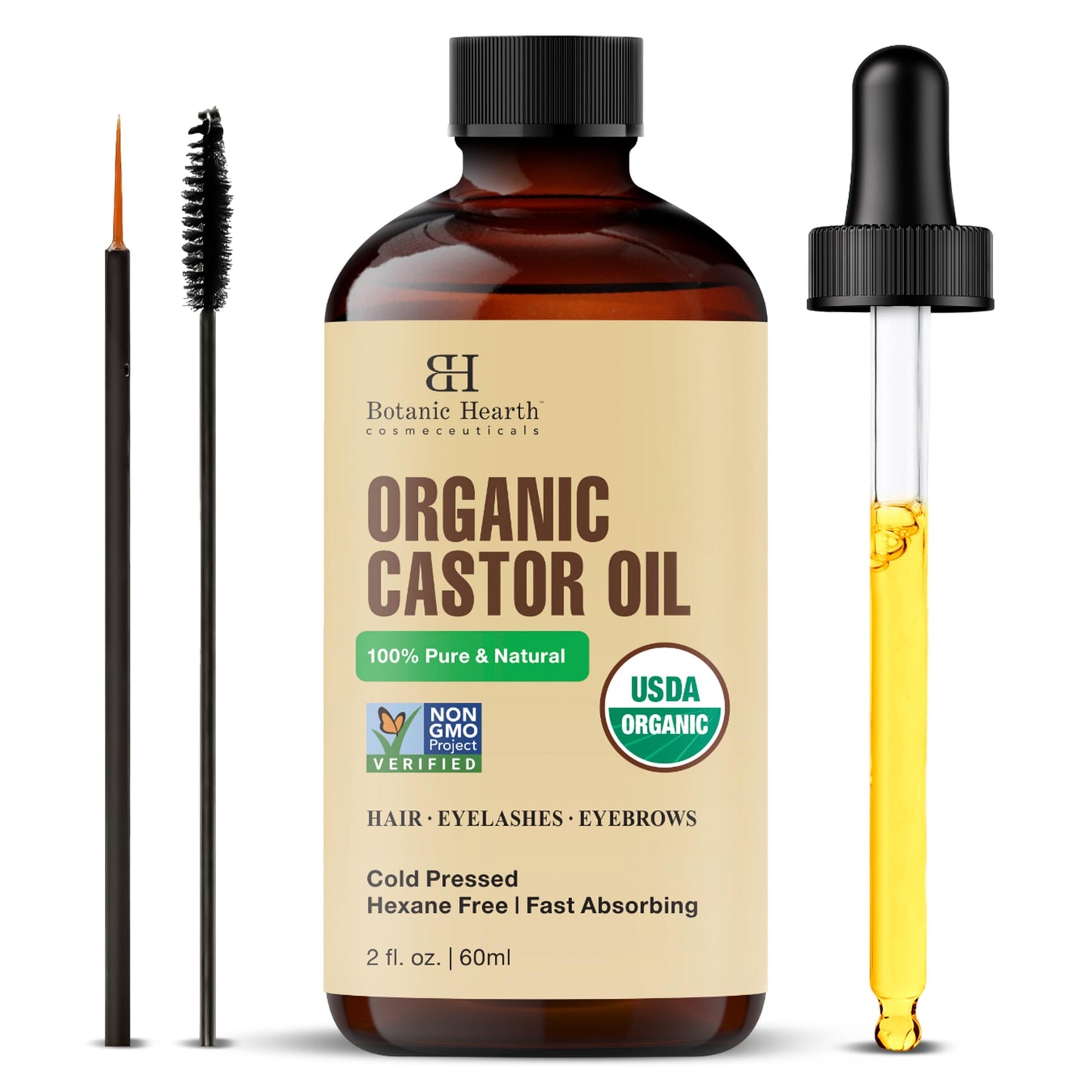 Organic castor oil bottle with dropper, brush, and label on a white background