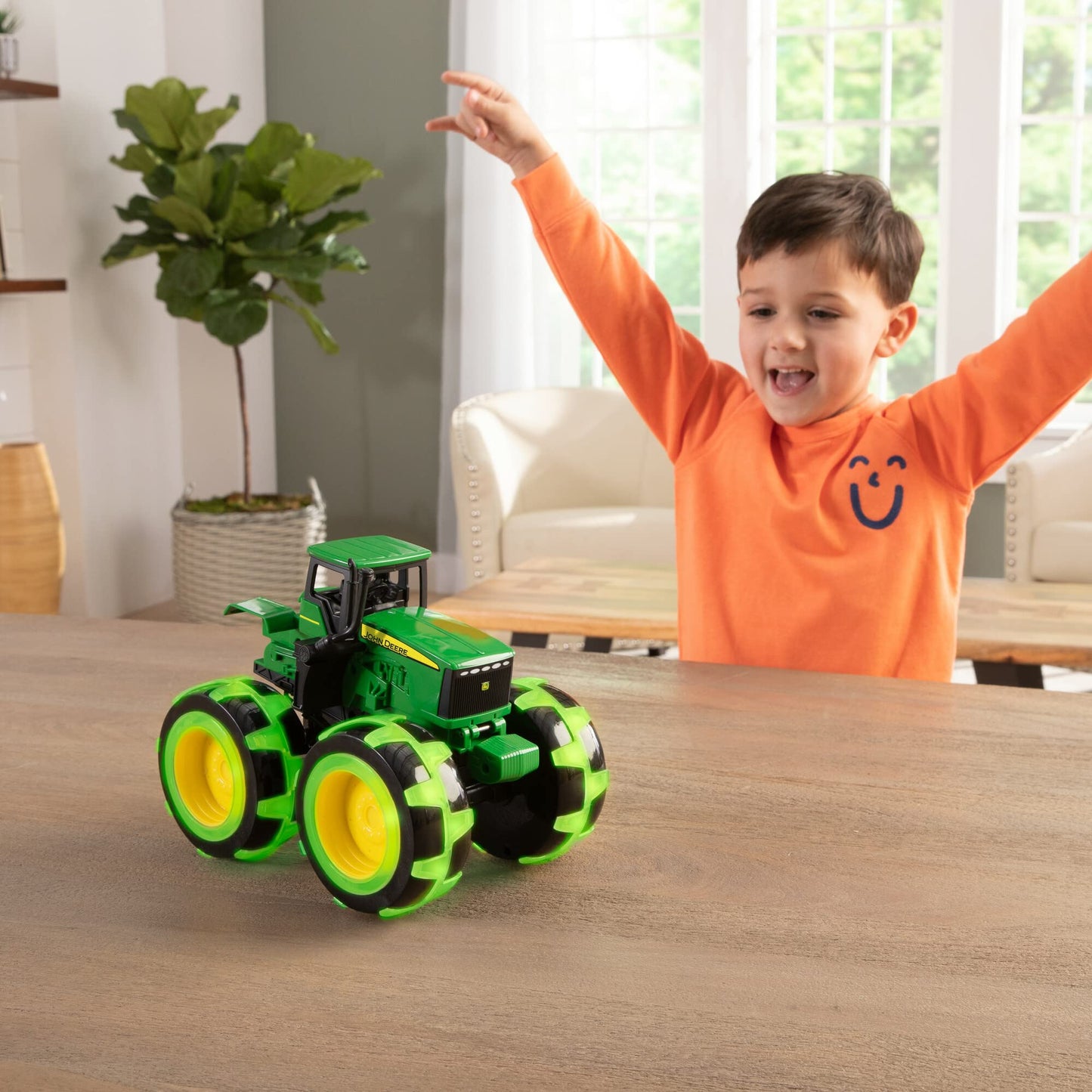 TOMY Monster Treads Lightning Wheels John Deere Tractor - Light-Up Motion Monster Truck Toy with Monster Tires for Ages 3+