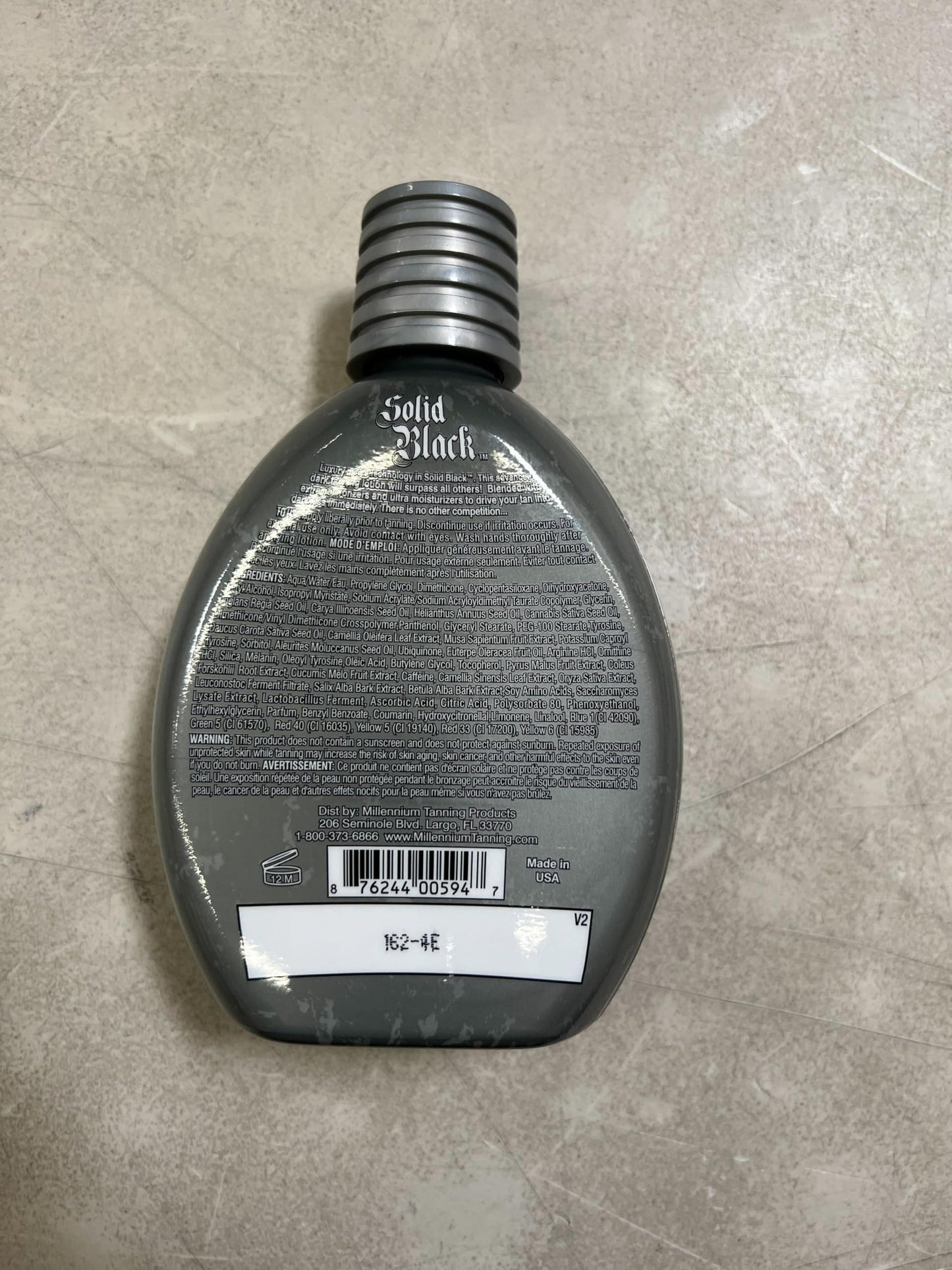 Millennium Tanning SOLID BLACK 100X Dark Tanning Lotion Indoor Outdoor Tan Enhancing Silicone Bronzer Tanning Bed Lotion 13.5 Fl oz (400 ml)