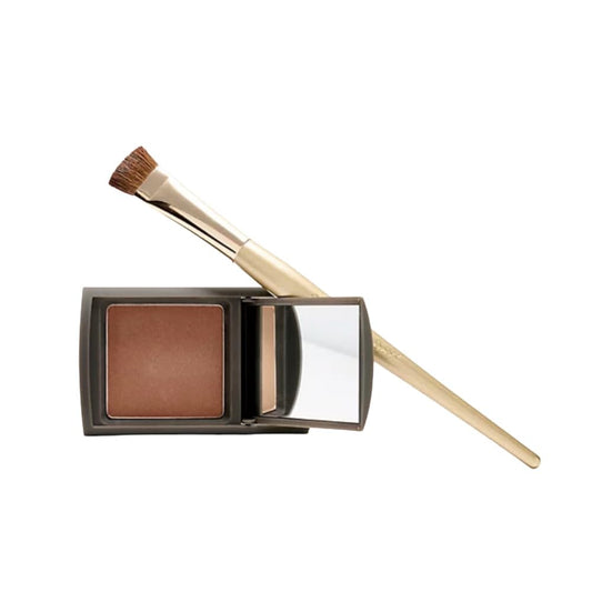 Makeup product with a brush on a white background