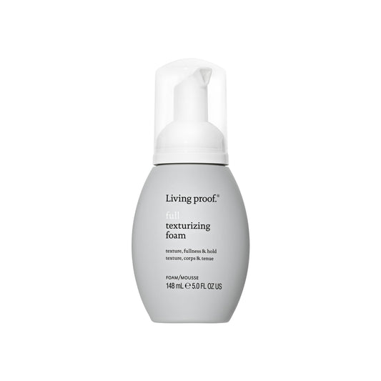 Living Proof texturizing foam bottle on a white background