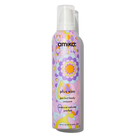 Amika mousse bottle with colorful floral design on a white background