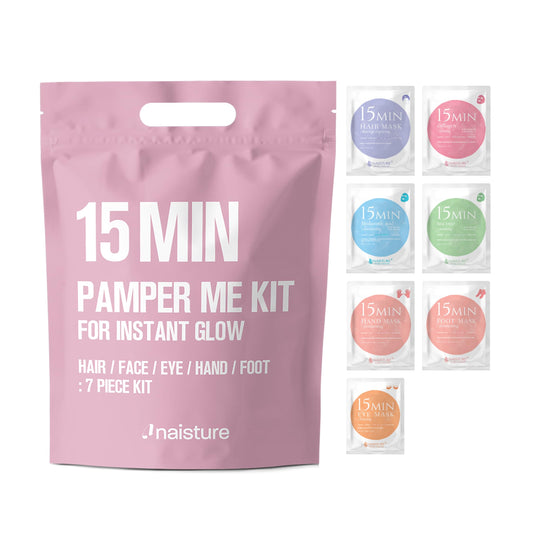 Pink '15 Min Pamper Me Kit' packaging with small sample packets displayed on a white background.