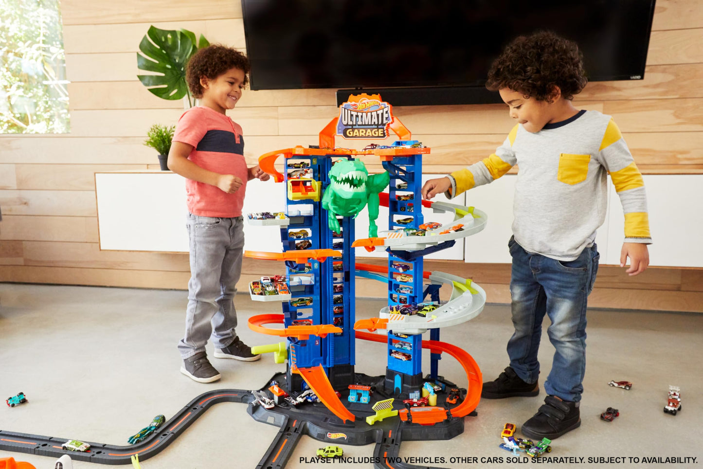 Hot Wheels Ultimate Garage City Playset with 2 Cars, Multi-Level Racetrack, Moving T-Rex & Storage for 100+ 1:64 Vehicles